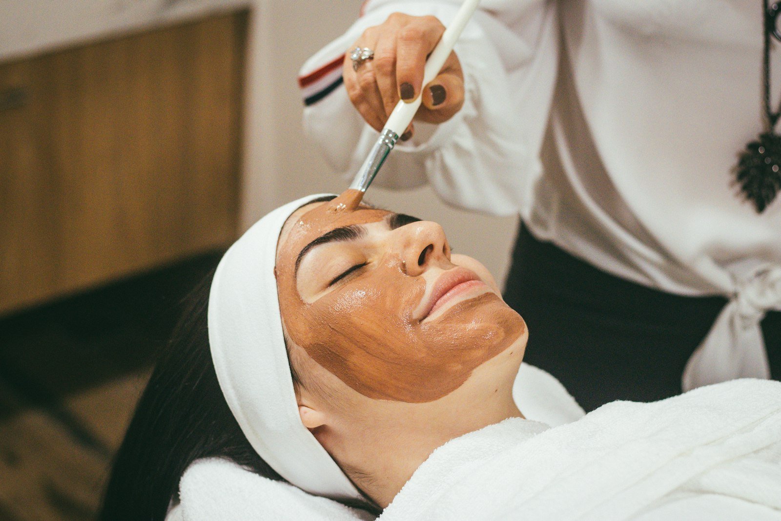 Woman receiving a professional facial treatment at Skin Story Aesthetic Islamabad